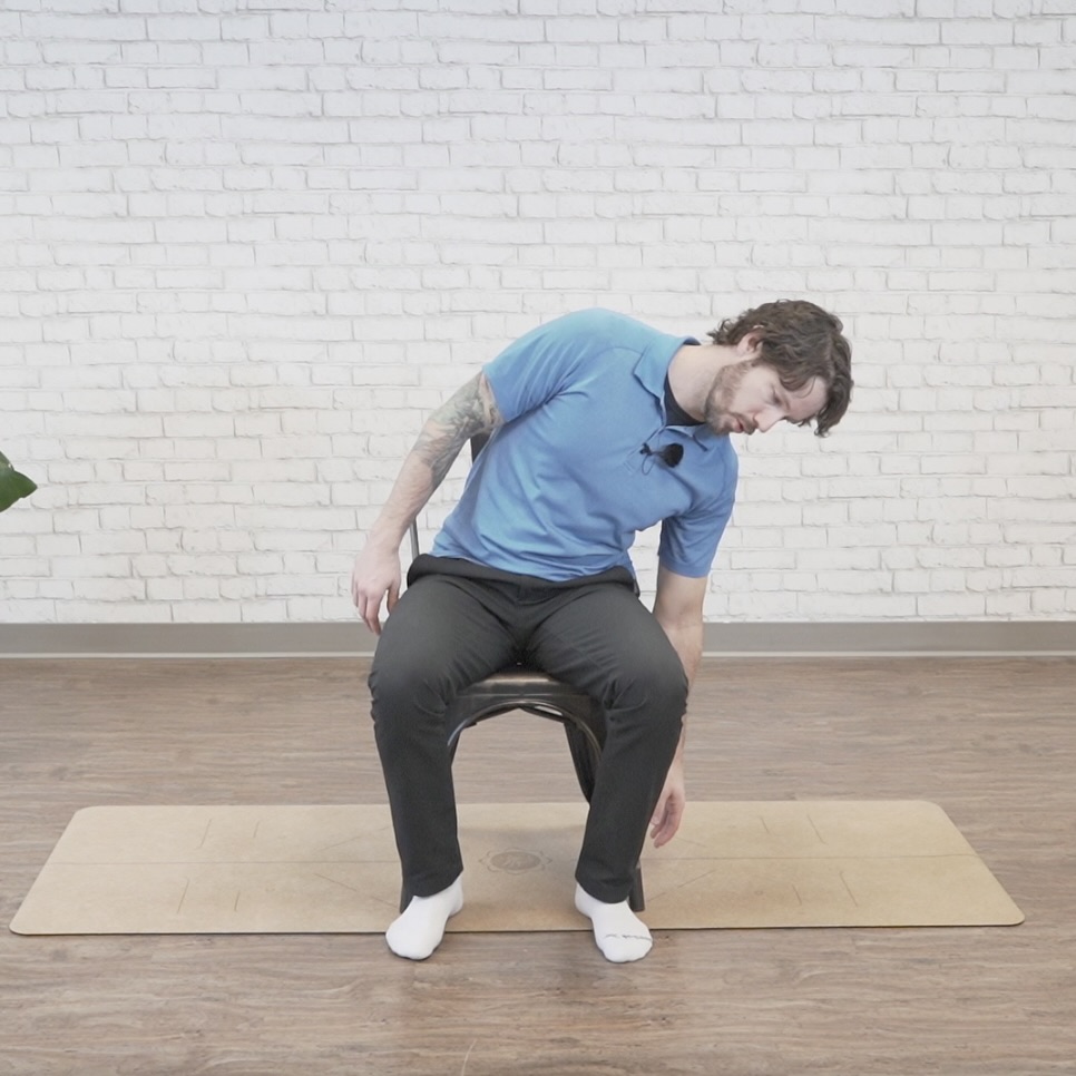 Seated side bend core exercise to the right
